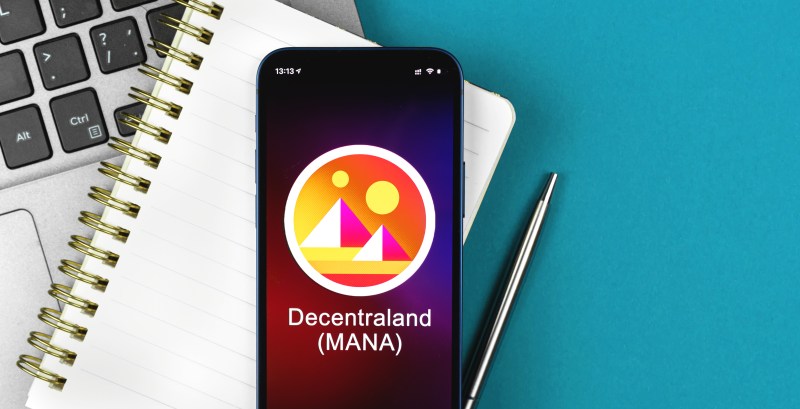 Decentraland symbol Trade with cryptocurrency digital and virtual money banking with mobile phone concept Business workspace table top view photo NFT News Today